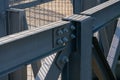 pedestrian walkway, construction detail of bolted metal beams.