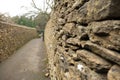 Pedestrian walkway with old stone wall in UK
