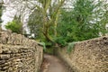 Pedestrian walkway with old stone wall in UK