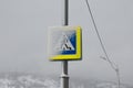 Pedestrian walkway sign covered with snow Royalty Free Stock Photo