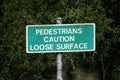 Pedestrian warning sign for loose surface. Royalty Free Stock Photo