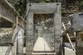 Pedestrian wooden and steel rope bridge over water a river