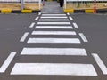 A pedestrian zebra cross at parking lot