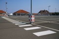 Pedestrian zebra crossing in an empty parking lot on the roof of a supermarket