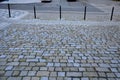 In the pedestrian zone, the entrance is regulated by black decorative steel posts. the post can be tilted to the ground for passer