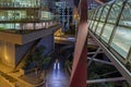 Pedestrians Bridge and Underground Traffic at Night at La Defense Business District Royalty Free Stock Photo