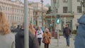 Pedestrians cross road on crossway with trafficlights