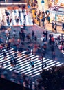 Pedestrians cross the Shibuya Scramble crosswalk, in Tokyo, Japan Royalty Free Stock Photo