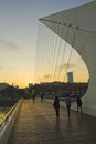 Pedestrians crossing the Bridge of the Woman. Puerto Madero neighborghood or disctrict in Buenos Aires city, Argentina