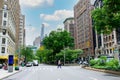 Pedestrians crossing Broadway at West 77th Street in Manhattan. Urban cityscape. - New York, USA - June, 2021