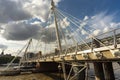 Pedestrians crossing The Queen`s Golden Jubilee Footbridges in the summertime,London,England,UK Royalty Free Stock Photo