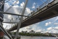 Pedestrians crossing The Queen`s Golden Jubilee Footbridges in the summertime,London,England,UK Royalty Free Stock Photo