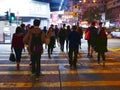 Pedestrians Crossing Road in Crowded City