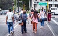 Pedestrians crossing road in Sandton city