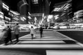 Pedestrians crossing the street at the heart of Ginza District in Tokyo. Ginza crossing at night. Blurred motion