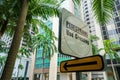 Pedestrians crossing street sign in exotic city Royalty Free Stock Photo