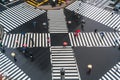 Pedestrians crossing with umbrellas, Sukiyabashi, Ginza, Tokyo