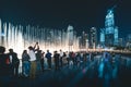 Pedestrians at Dubai Fountain at night Dubai - UAE Royalty Free Stock Photo