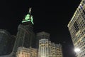 Pedestrians heading to the Haram Mosque in Mecca and Mecca Royal Clock Tower Hotel Royalty Free Stock Photo