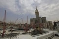 Pedestrians heading to the Haram Mosque in Mecca and Mecca Royal Clock Tower Hotel Royalty Free Stock Photo