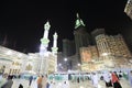 Pedestrians heading to the Haram Mosque in Mecca and Mecca Royal Clock Tower Hotel Royalty Free Stock Photo