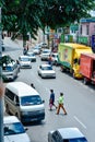 Pedestrians jaywalking the street at downtown Sibu