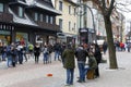 Pedestrians are listening to street musicians Royalty Free Stock Photo