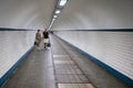 Pedestrians passing a hiking tunnel under river Schelde at Antwerp, Belgium Royalty Free Stock Photo