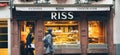 Pedestrians people walking in front of Ross Patissier Chocolatier bakery in