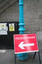 Pedestrians sign with arrow direction pointer in London
