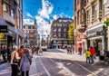 Pedestrians and Trams on the busy Leidsestraat in the center of Amsterdam