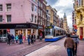 Pedestrians and Trams on the busy Leidsestraat in the center of Amsterdam