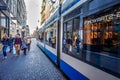 Pedestrians and Trams on the busy shopping street of the Leidsestraat in the center of Amsterdam Royalty Free Stock Photo