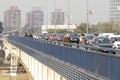Pedestrians and vehicles on the city street Branko bridge,, on a sunny polluted day
