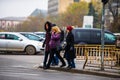 Pedestrians waiting to cross the street in Bucharest, Romania, 2019