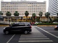 pedestrians are waiting on zebra crossing to cross the street