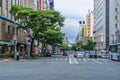 Pedestrians walk across a busy traffic intersection in Fukuoka, Japan Royalty Free Stock Photo