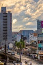 Pedestrians walk along busy streets of Fukuoka, Japan on a rainy evening Royalty Free Stock Photo