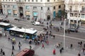 Pedestrians walk and cars go at Gran Via street