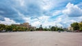 Pedestrians walk on Freedom Square at sunny day in Kharkiv, Ukraine.