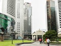 Pedestrians walk in the Raffles Place, Singapore