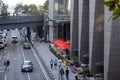 pedestrians walking and bicycling on a crowded city street, manhattan hudson yards