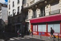 Pedestrians walking down Parisian streets in 10th arrondissement