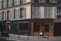 Pedestrians walking down Parisian streets in 10th arrondissement