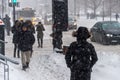 Pedestrians walking in Downtown Montreal during snow storm