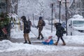 Pedestrians walking on Mont-Royal Avenue during snow storm Royalty Free Stock Photo