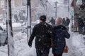 Pedestrians walking on Mont-Royal Avenue during snow storm Royalty Free Stock Photo