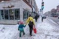 Pedestrians walking on Mont-Royal Avenue during snow storm Royalty Free Stock Photo