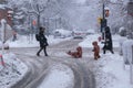 Pedestrians walking on Mont-Royal Avenue during snow storm Royalty Free Stock Photo