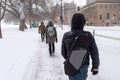 Pedestrians walking on Mont-Royal Avenue during snow storm Royalty Free Stock Photo